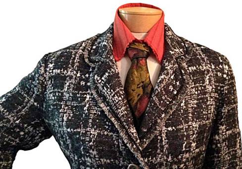 Jacket buttoned over LBD.